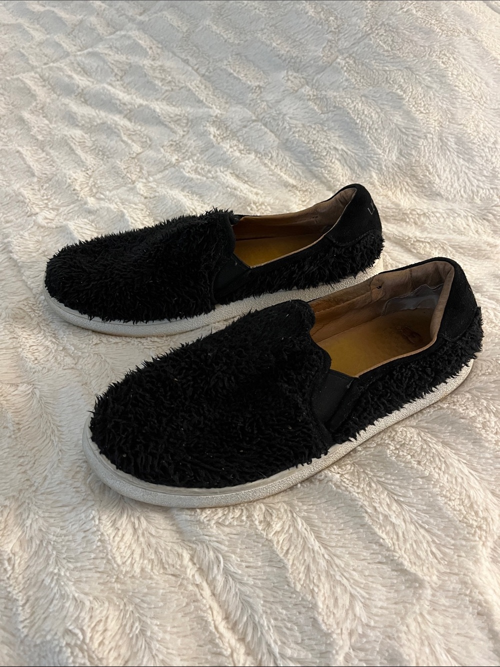 UGG Black Fuzzy Slip-On Loafers with White Soles